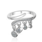 Elegant silver ring adorned with three diamonds and a chic dangling chain, perfect for any occasion.